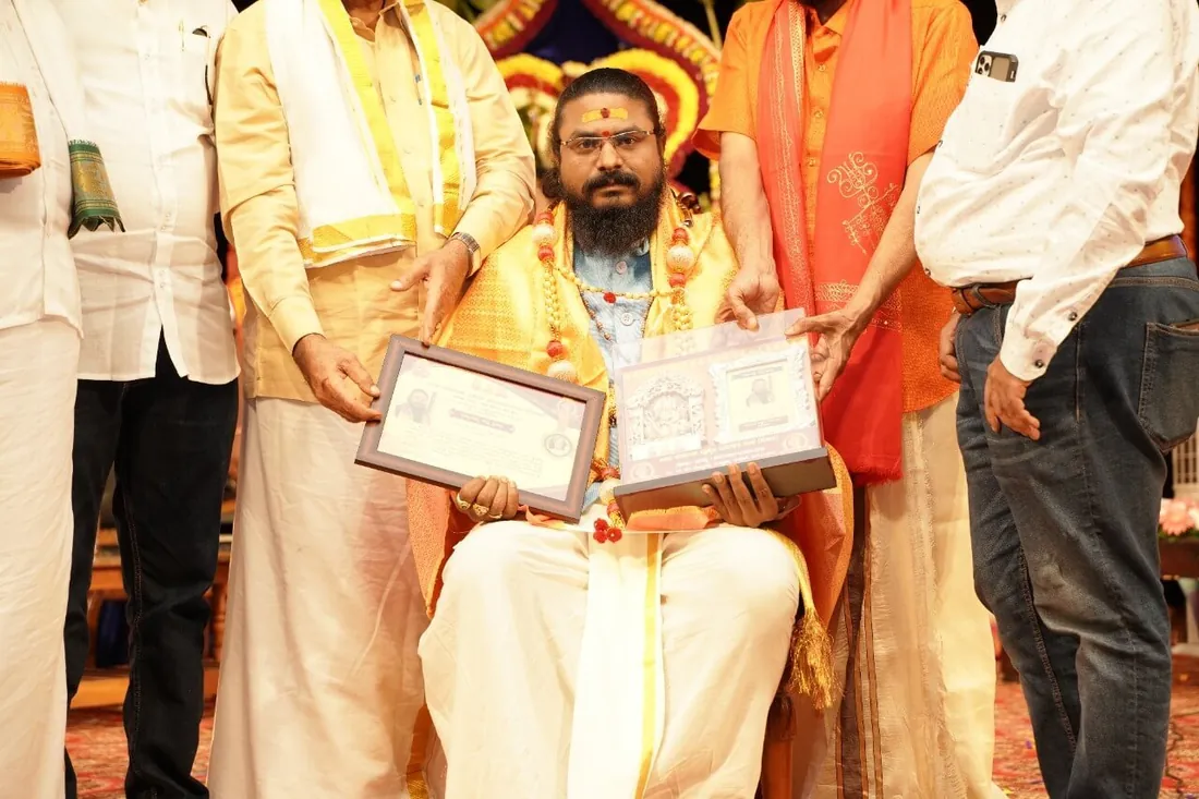 Arun Sharma Guruji being presented with a citation and plaque