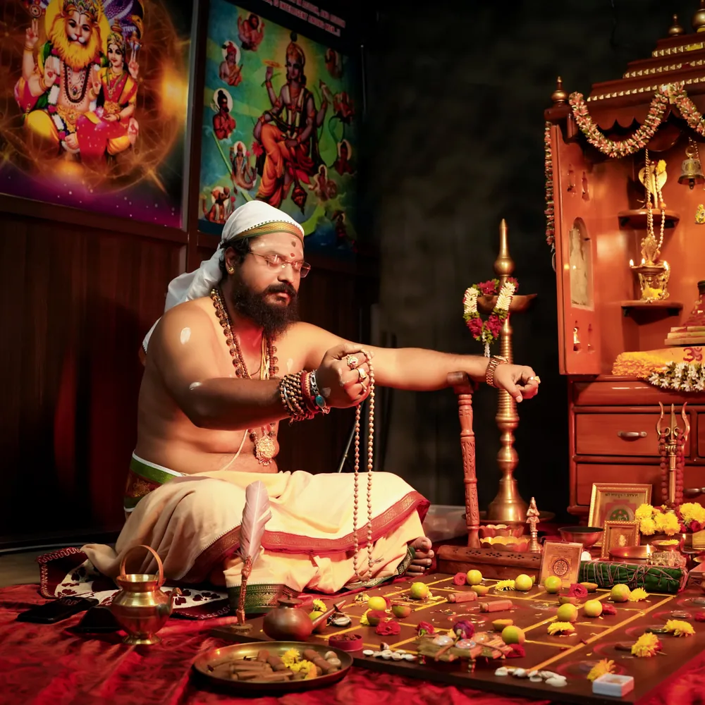 Arun Sharma Guruji performing a traditional puja ritual