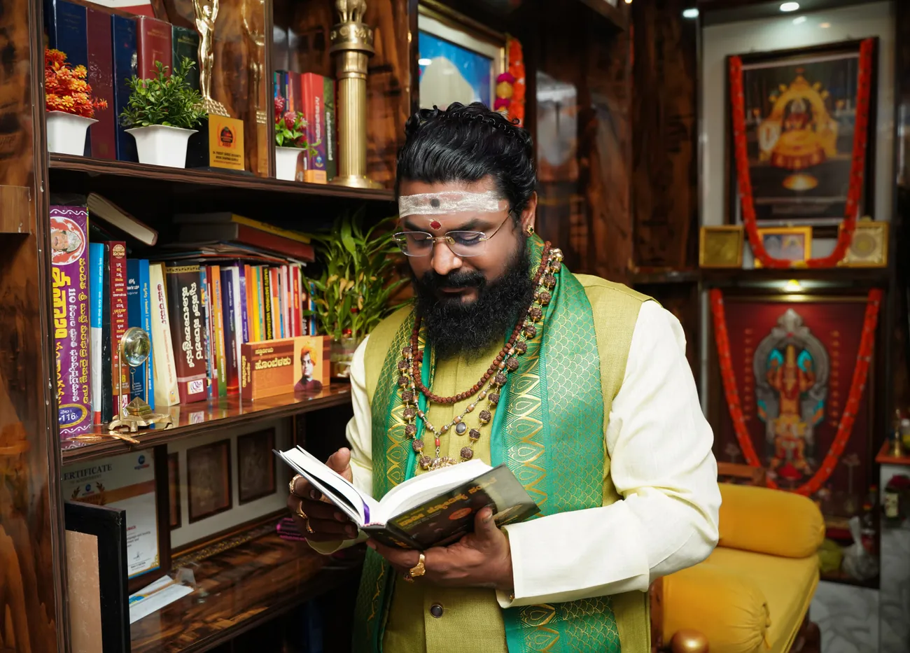 Arun Sharma Guruji reading a classical text in the consulting room at Whitefield